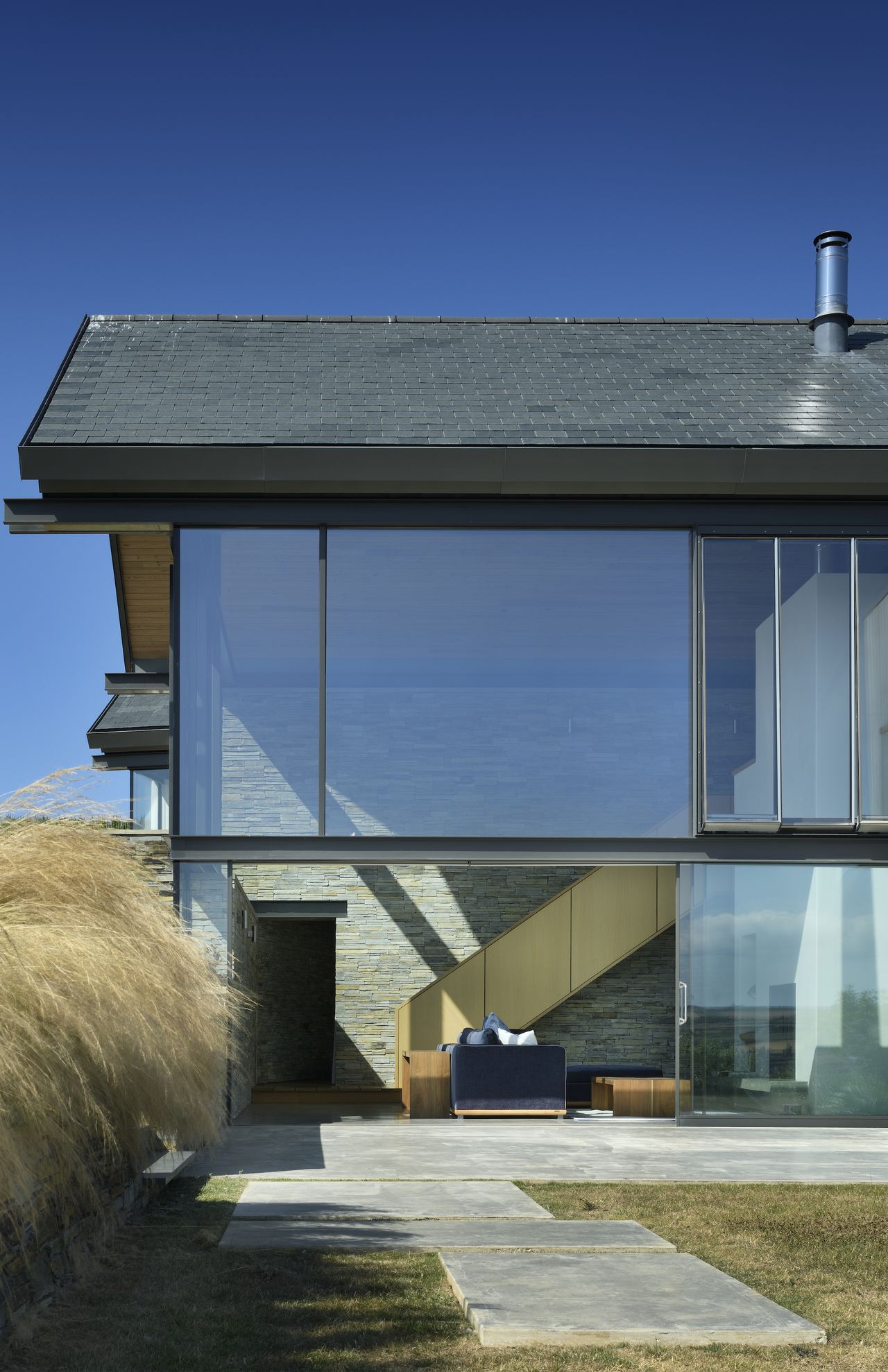 large windows into stone walls of living area