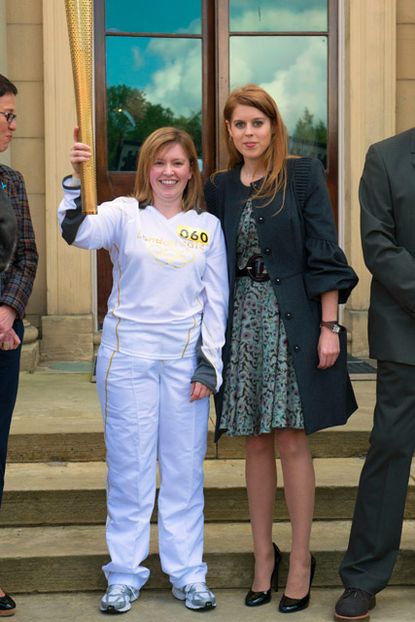 Princess Beatrice greets the Olympic Torch at Harewood House in Leeds