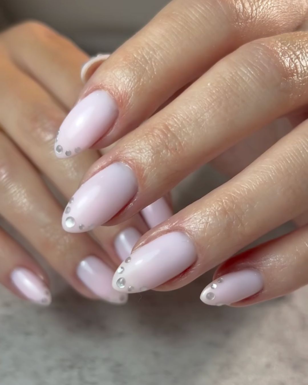 Mirror chrome dot French nails.