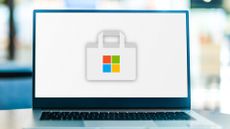 Laptop computer displaying logo of Microsoft Store