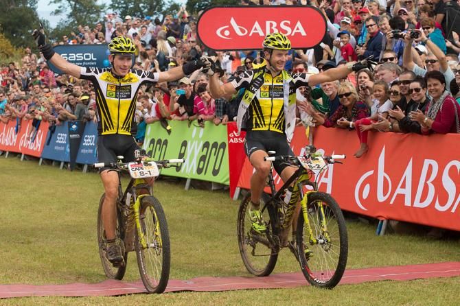 Robert Mennen (left) and Kristian Hynek of team Topeak Ergon celebrating winning the 2014 Cape Epic