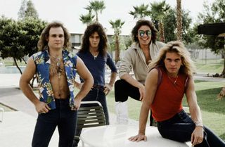 Van Halen posing in front of palm trees and a swimming pool