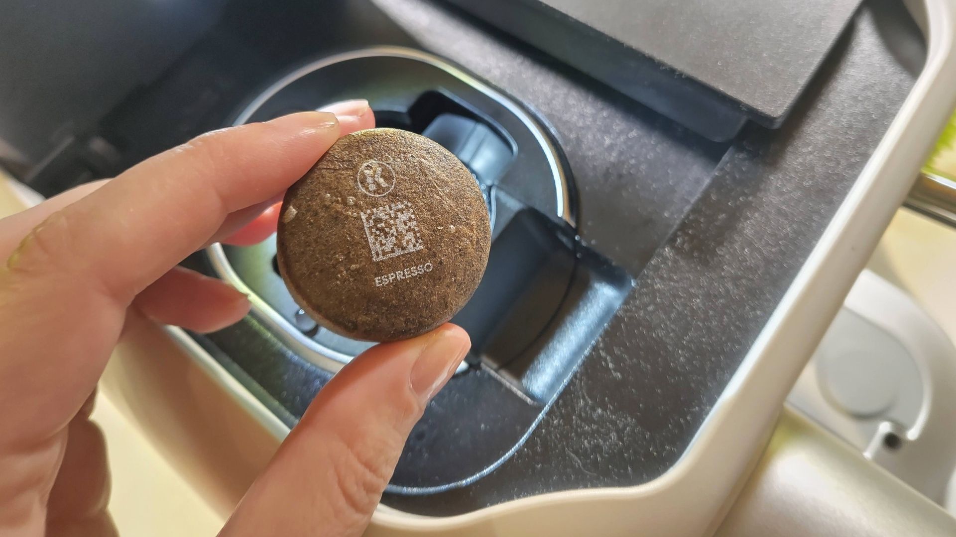 Inserting AltaRound pod in Keurig Alta coffee maker