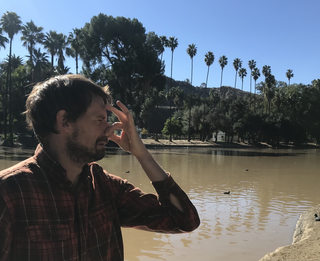 Dominik Hülse, an Earth system modeler based at University of California Riverside, worked on a November 2021 study that explored how ancient microbes may have prolonged the Permian extinction by producing a toxic gas. Here, Hülse poses with a finger to his nose to highlight the toxic "rotten egg" scent of hydrogen sulfide.
