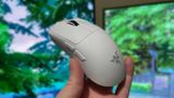 Holding a Razer Viper V4 Pro gaming mouse