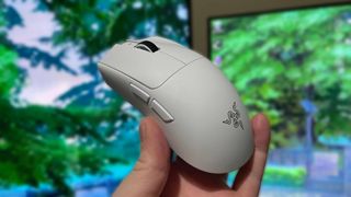 Holding a Razer Viper V4 Pro gaming mouse