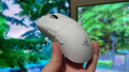 Holding a Razer Viper V4 Pro gaming mouse