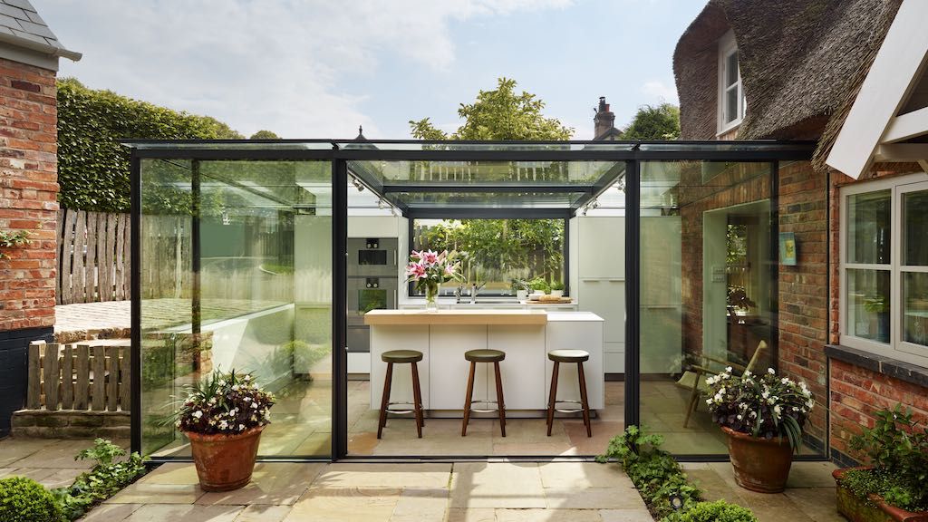 glass kitchen extension on thatched cottage 