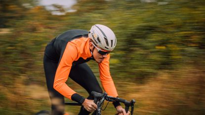  Image shows a rider wearing one of the best cycling helmets. 