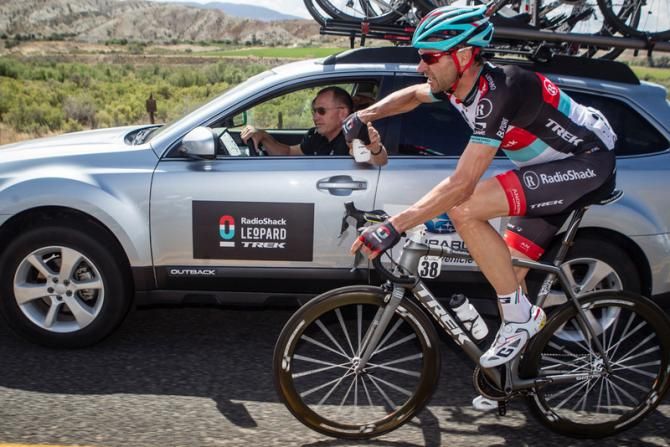 Jens Voigt (Radioshack) takes a bottle from the team car.
