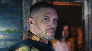 Walker outside of cabin in bulletproof vest in Havoc