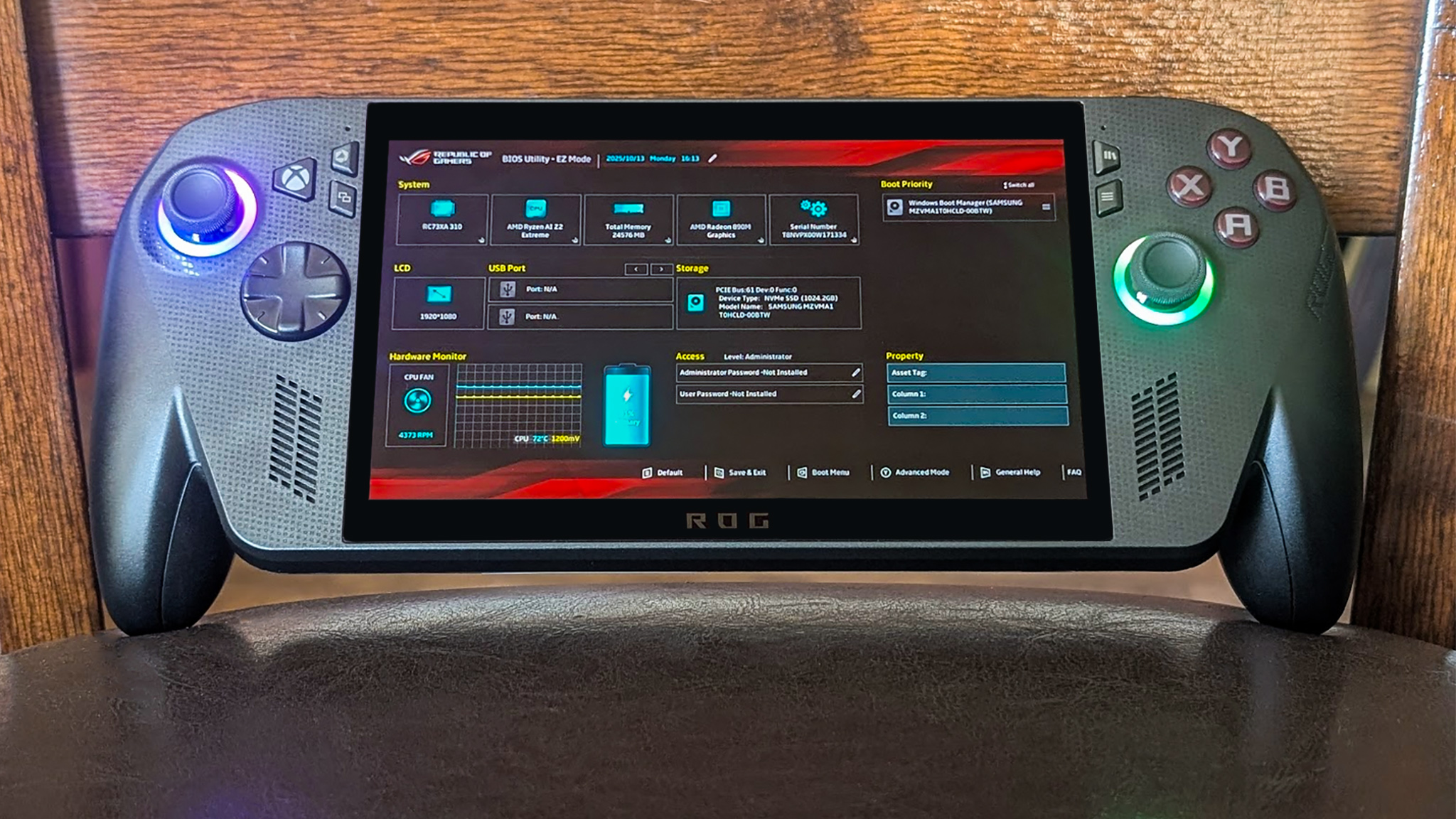 Xbox Ally X propped up against a chair and displaying the BIOS on the screen.