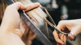 woman giving haircut