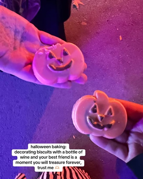 Two hands holding pumpkin-shaped sweet treats with text about halloween baking.