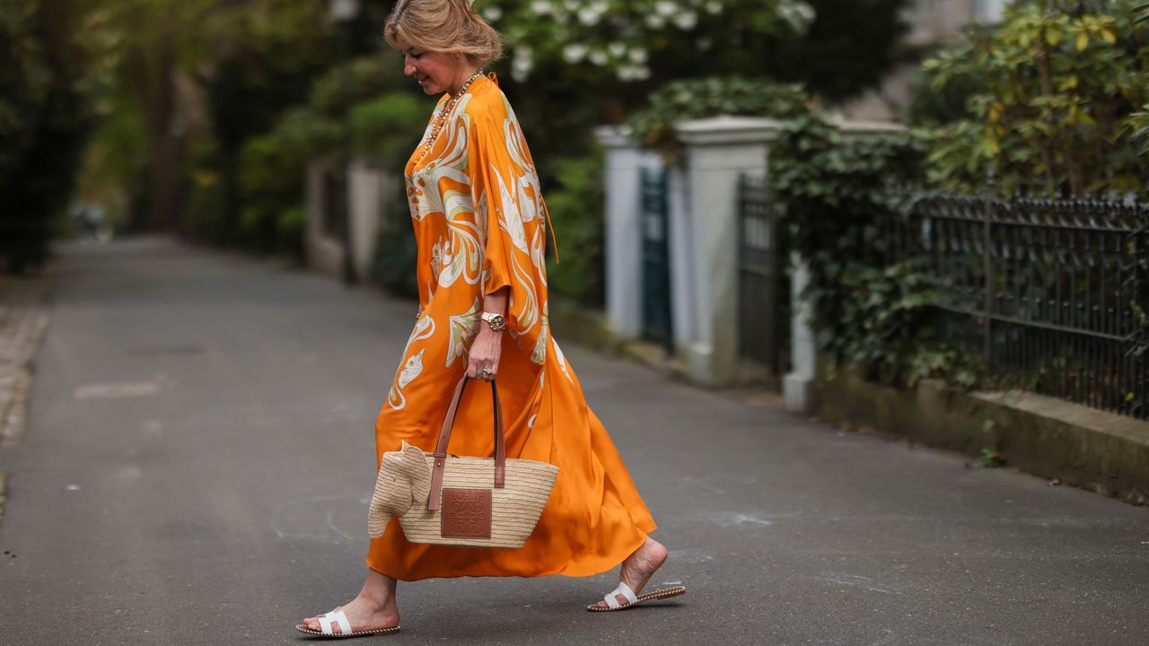 Holiday packing list: Fashion week show goers wear orange, holiday-inspired looks