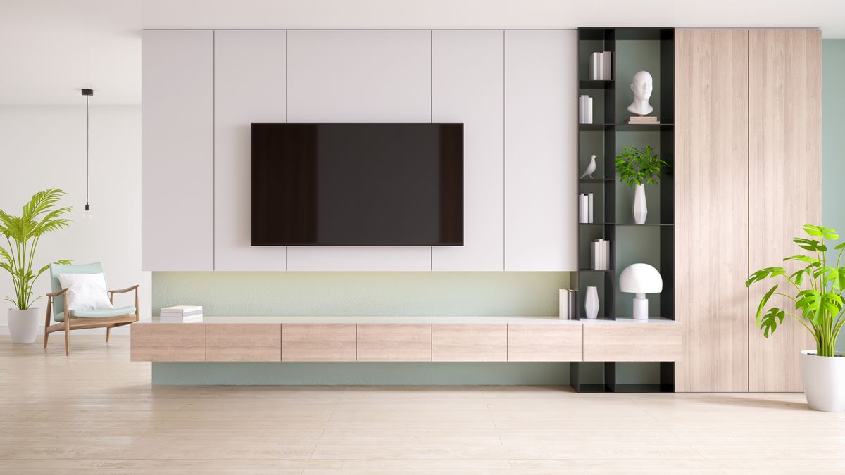 Tv Cabinet And Display With On Wood Flooring And Pastel Green Wall,