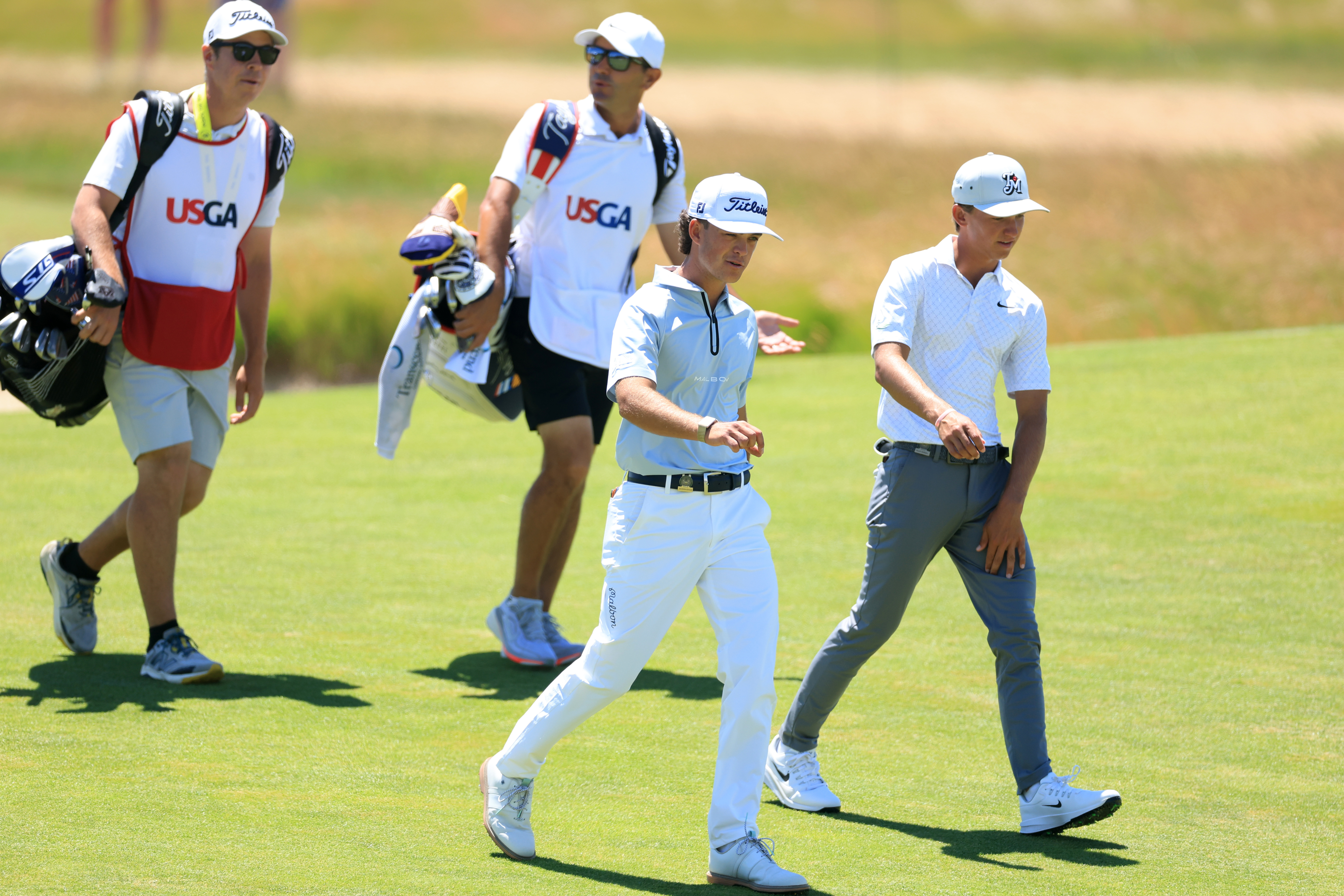 Jackson Koivun and Miles Russell walking down the fairway at the 2026 US Open