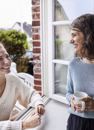 Neighbours speaking to one another