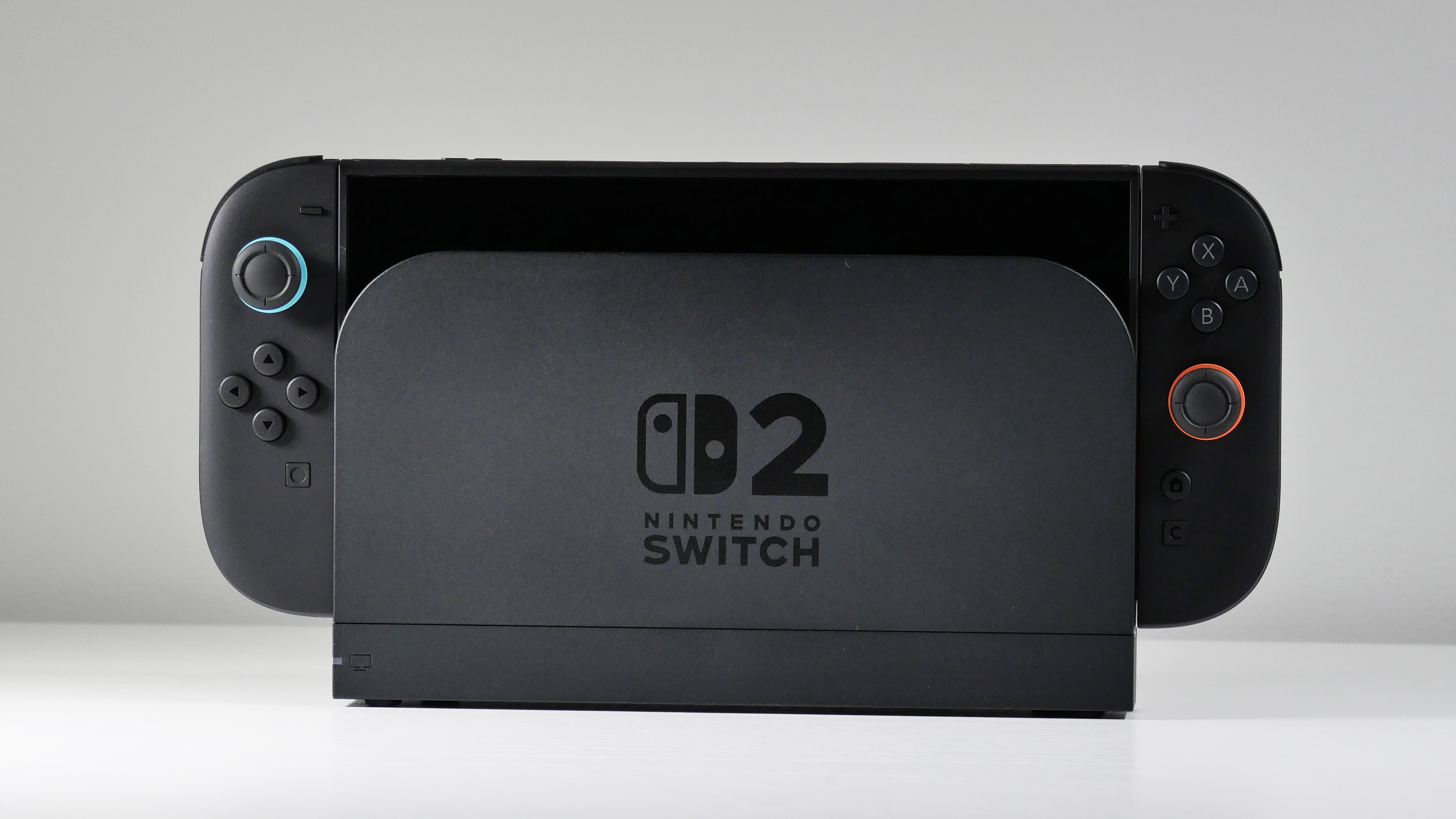 Nintendo Switch 2 docked on a white desk.