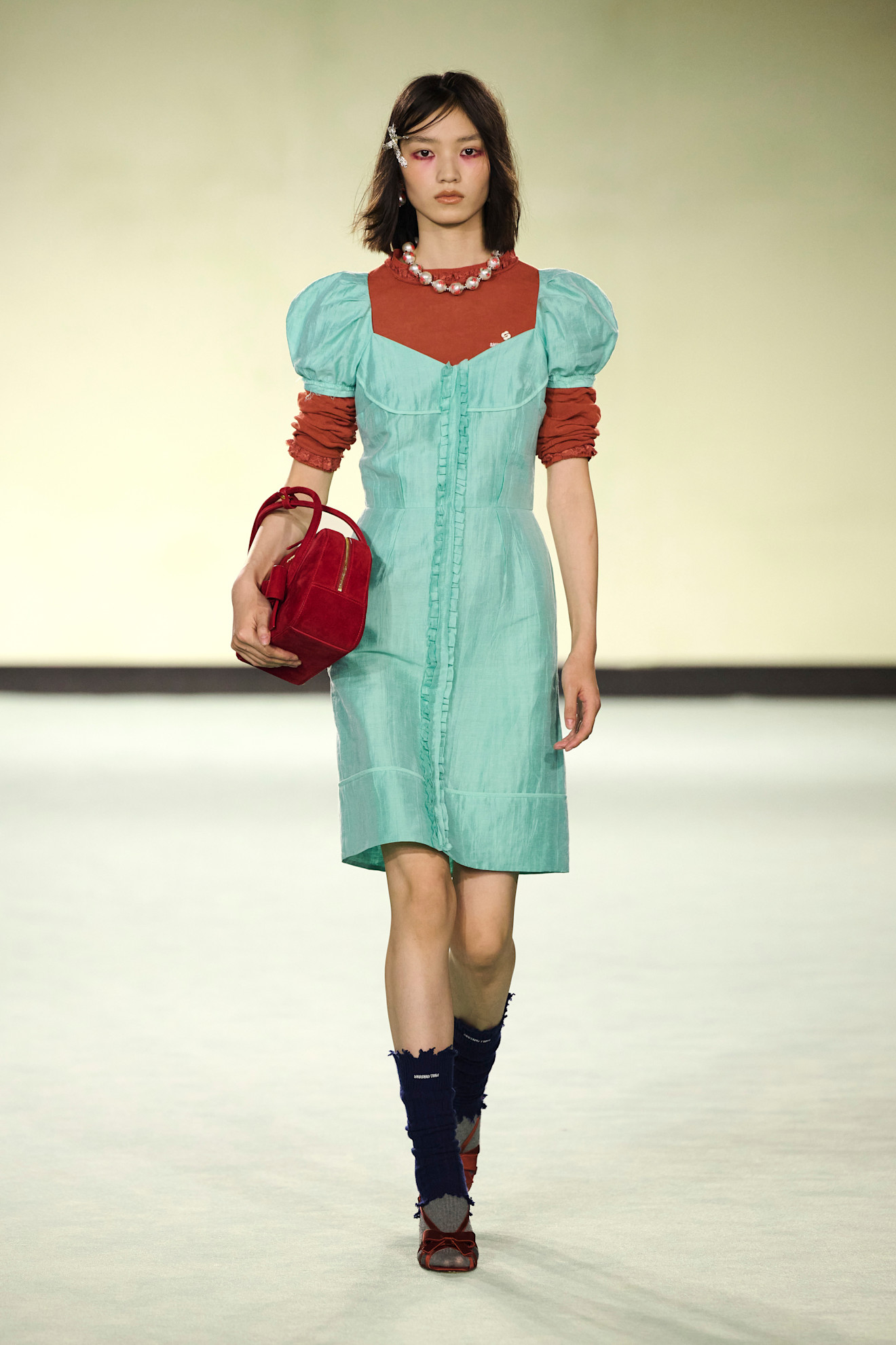 A model wore a babydoll dress on Shushu/Tong's Spring 2026 runway