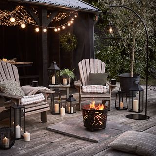 outdoor seating area with chairs and fire pit