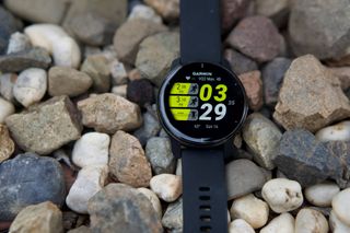 The Garmin Venu 2 Plus with a custom watchface showing recent workouts and Vo2 Max