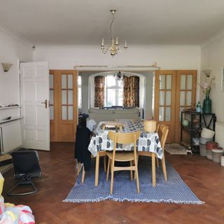 Living room with wooden table and blue rug