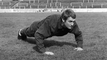 Rodney marsh doing push-ups in the 1960s