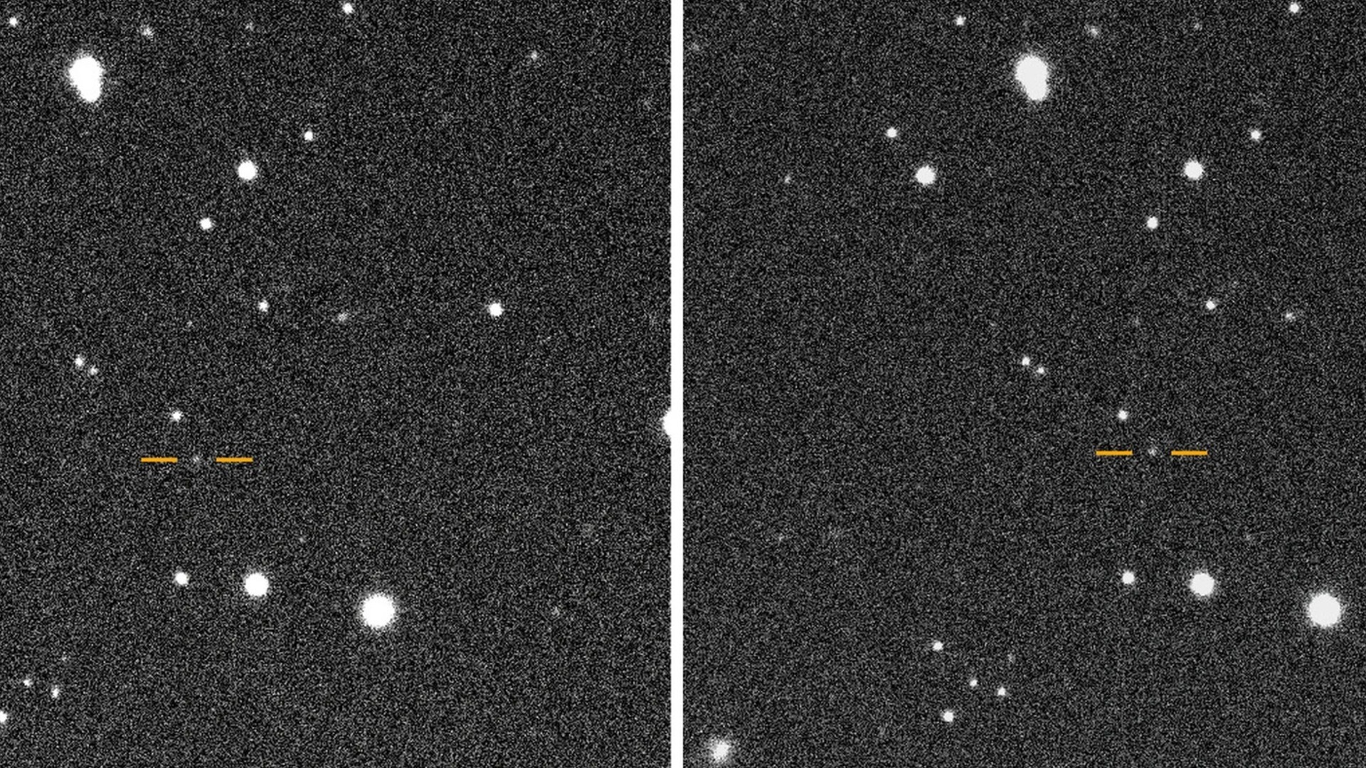 a white blurry dot on a black starry background