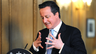 David Cameron speaks at a podium