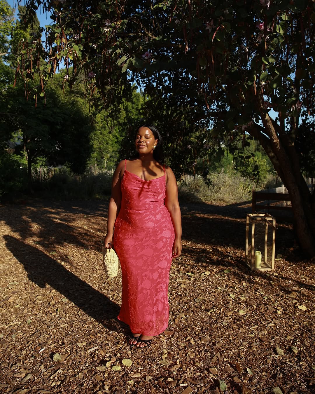 woman wearing red slip dress summer 2025