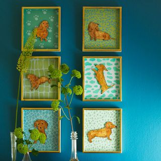 blue wall with animal frames and plants