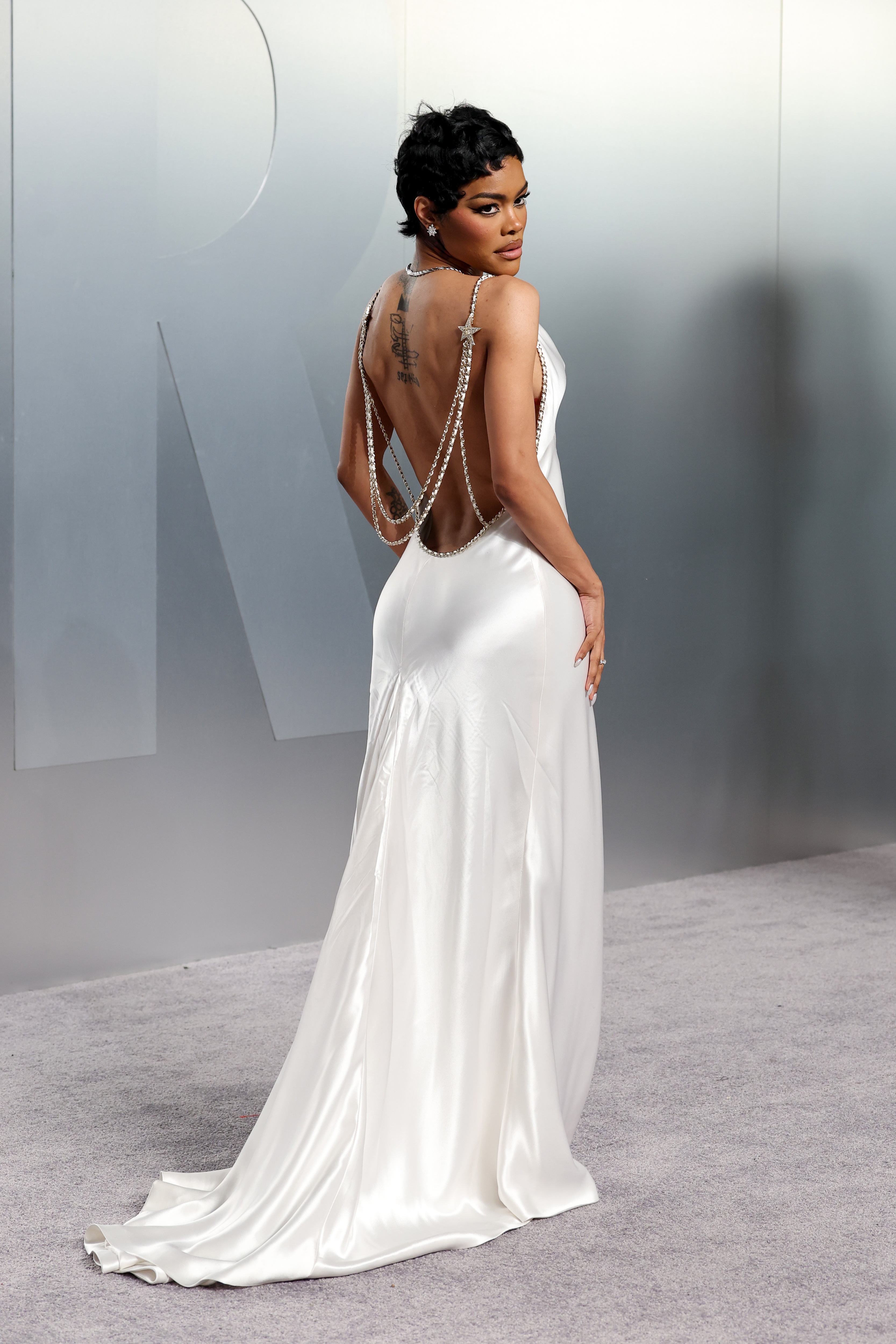 Teyana Taylor at the Oscars after-party in a white dress.