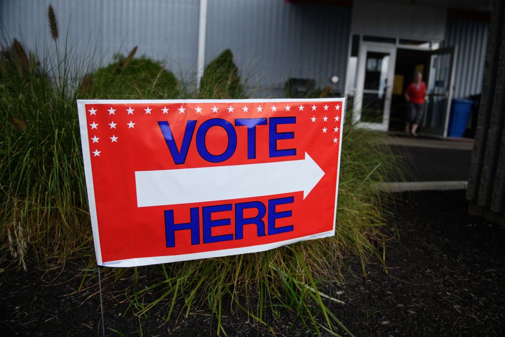 A sign pointing where to vote.