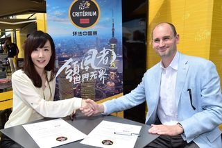 Kathy Zhou, General Manager of Activation Sports and Director of the Tour de France Branded Events in China, and Jean-Etienne Amaury
