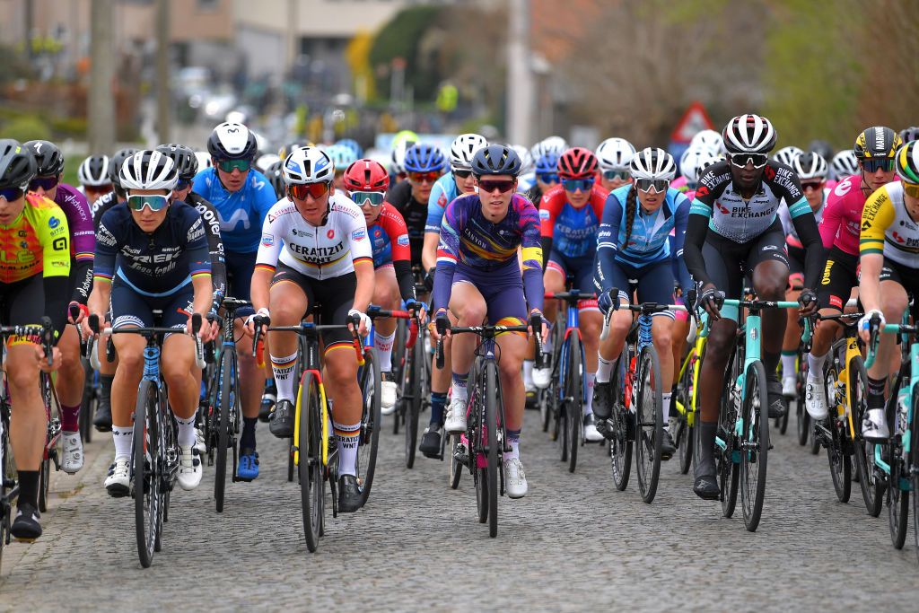 OUDENAARDE BELGIUM APRIL 04 Elisabeth DeignanArmitstead of United Kingdom and Team Trek Segafredo Lisa Brennauer of Germany and Ceratizit WNT Pro Cycling Team Hannah Barnes of United Kingdom and Team Canyon SRAM Racing Lucinda Brand of Netherlands and Team Trek Segafredo Teniel Campbell of Trinidad And Tobago and Team BikeExchange Marianne Vos of Netherlands and Jumbo Visma Women Team Pink UCI Womens WorldTour Leader Jersey during the 18th Ronde van Vlaanderen Tour of Flanders 2021 Womens Elite a 1524km race frim Oudenaarde to Oudenaarde Cobblestones Peloton RVV21 rondevanvlaanderen tourofflanders UCIWWT on April 04 2021 in Oudenaarde Belgium Photo by Luc ClaessenGetty Images