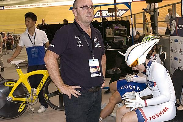 Australian sprint coach Gary West awaits the start to the womens' teams sprint alongside Aussie star Anna Meares.