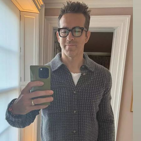 Ryan Reynolds posing in Guest in Residence