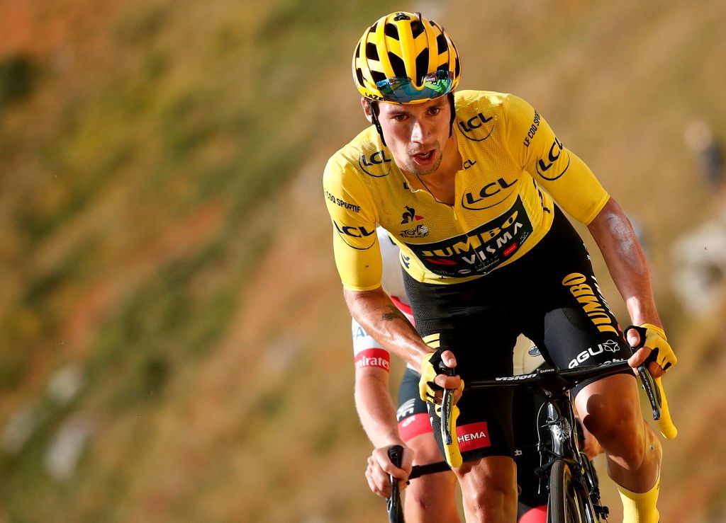 Team Jumbo rider Slovenias Primoz Roglic wearing the overall leaders yellow jersey C arrives with Team UAE Emirates rider Slovenias Tadej Pogacar unseen at the finish line of the 13th stage of the 107th edition of the Tour de France cycling race 191 km between ChatelGuyon and Puy Mary on September 11 2020 Photo by BENOIT TESSIER POOL AFP Photo by BENOIT TESSIERPOOLAFP via Getty Images