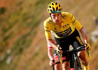 Team Jumbo rider Slovenias Primoz Roglic wearing the overall leaders yellow jersey C arrives with Team UAE Emirates rider Slovenias Tadej Pogacar unseen at the finish line of the 13th stage of the 107th edition of the Tour de France cycling race 191 km between ChatelGuyon and Puy Mary on September 11 2020 Photo by BENOIT TESSIER POOL AFP Photo by BENOIT TESSIERPOOLAFP via Getty Images