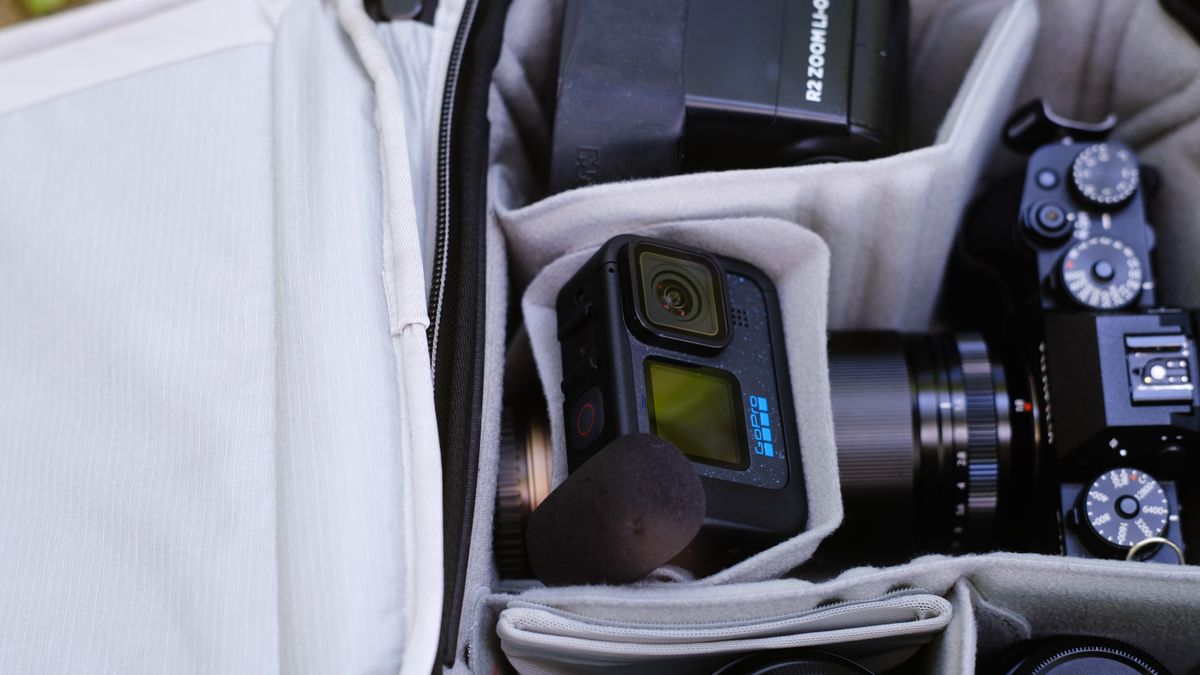 The Peak Design Travel Backpack 20L in use by a photographer