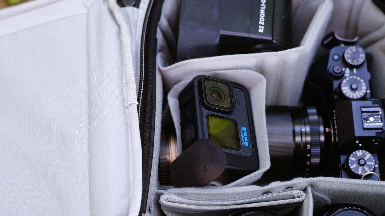 The Peak Design Travel Backpack 20L in use by a photographer