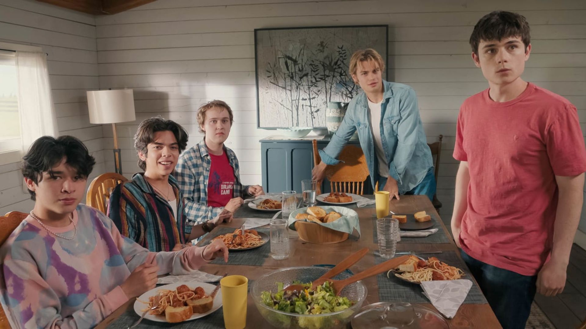 The boys all look shocked around the dining room table
