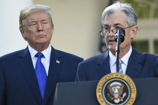 Federal Reserve Chair Jerome Powell and President Donald Trump standing in front of White House podium on November 2, 2017.