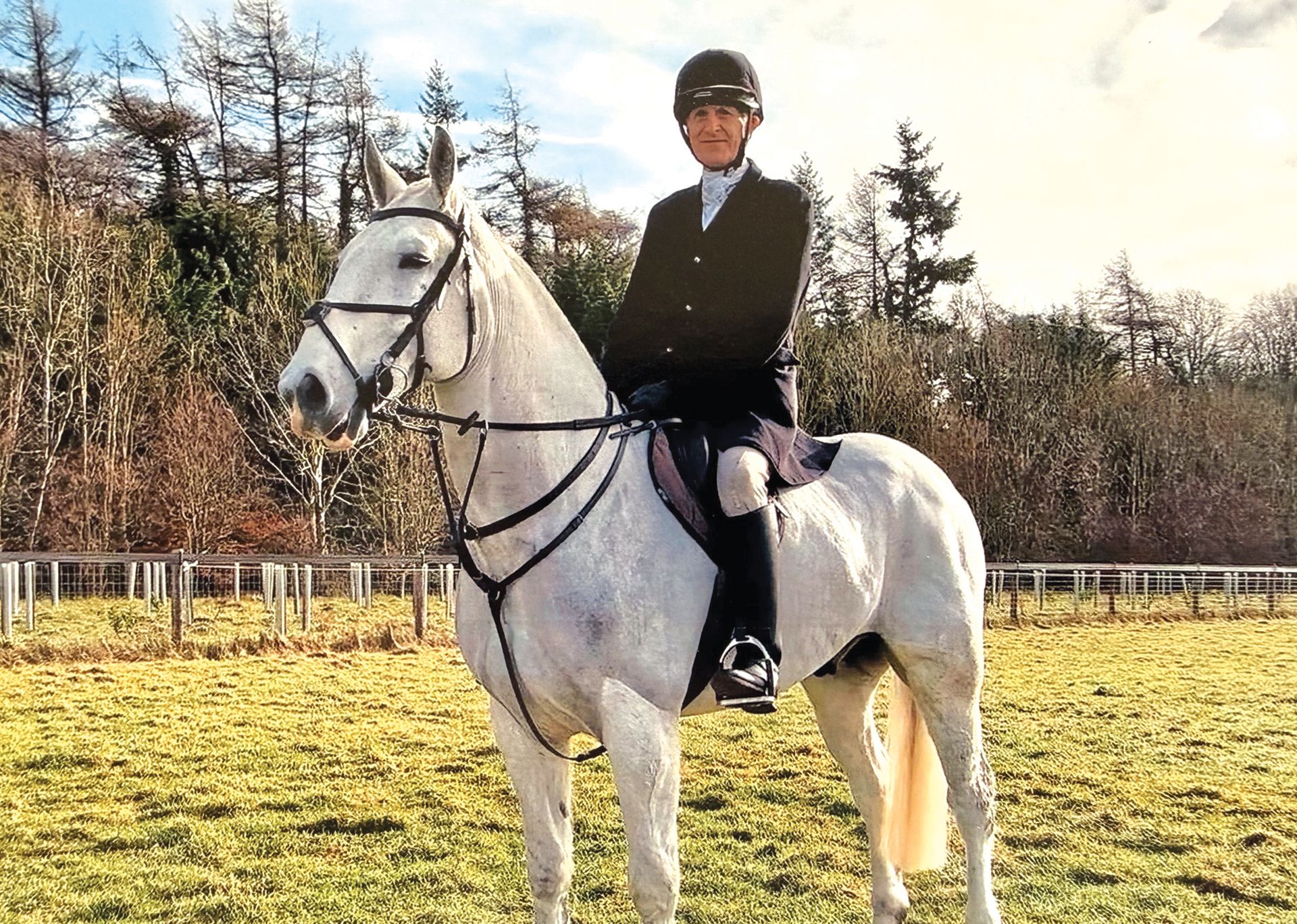 Jonathan Hull at a trail hunting meet riding a grey hunter called Con