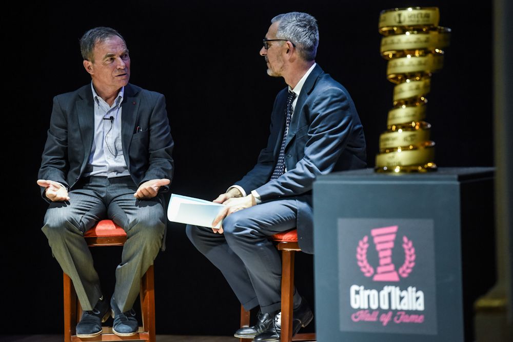 Bernard Hinault is interviewed on stage during the Giro Hall of Fame induction ceremony