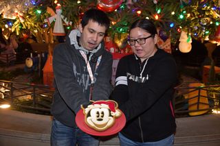 Christine and Robert Romero at DCA with a Magic Shot cookie