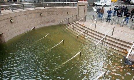 Flood waters totally submerge a subterranean entrance to a building in souther Manhattan on Oct. 30: Hurricane Sandy ignited the climate change debate.