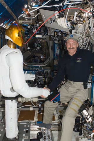 Robonaut 2's First Handshake with a Human