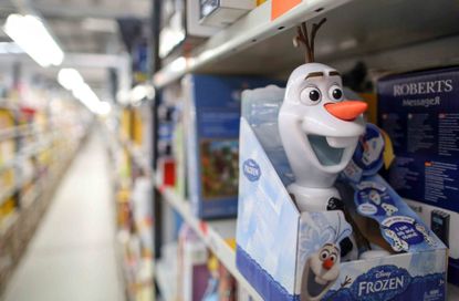 An Olaf toy from the Disney film Frozen stands on a shelf at an Amazon.com fulfillment center.